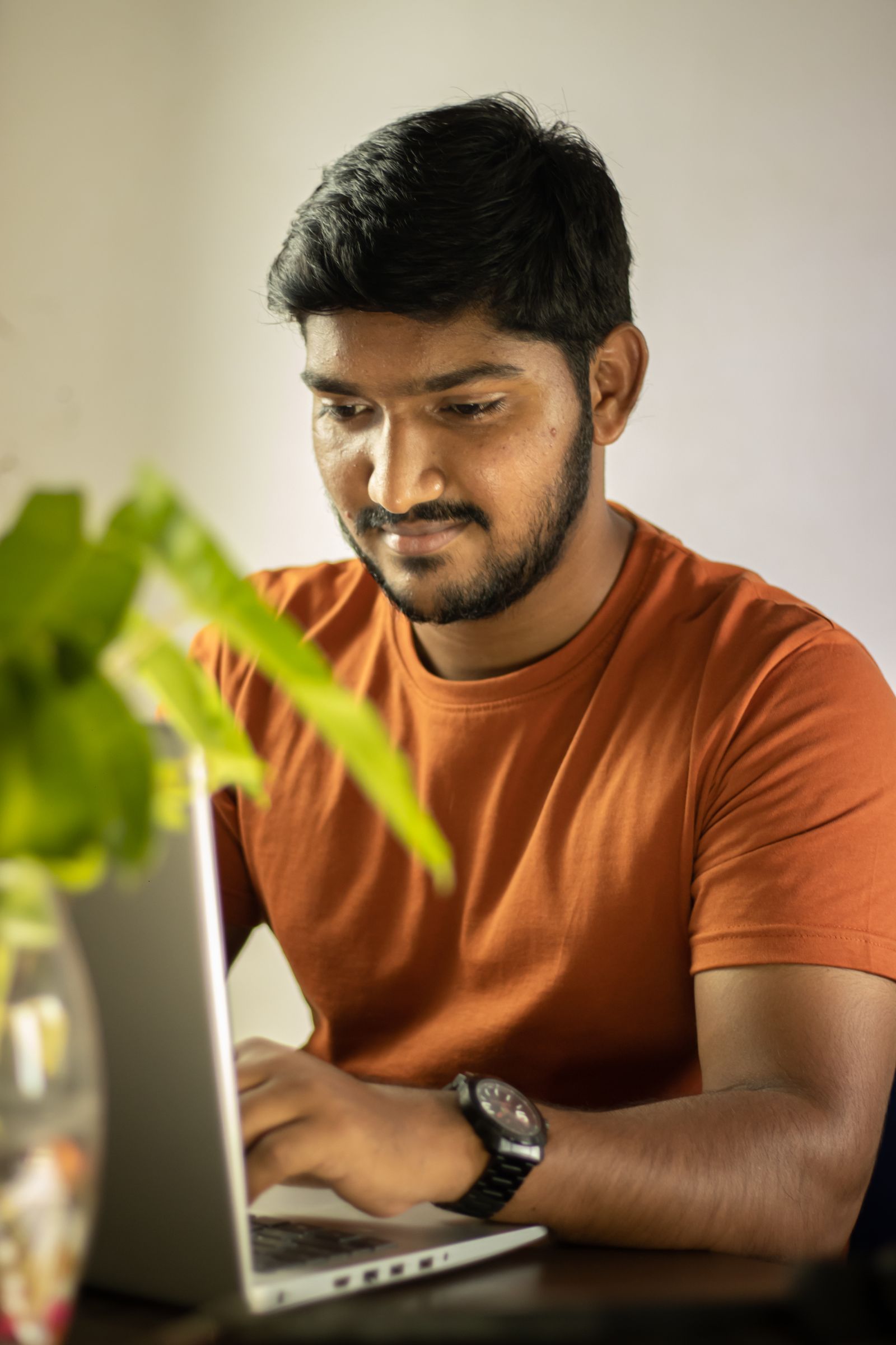 A young man working on a laptop